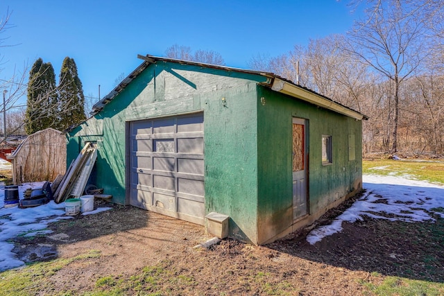 view of outbuilding featuring a garage