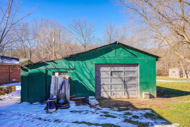 view of snow covered garage