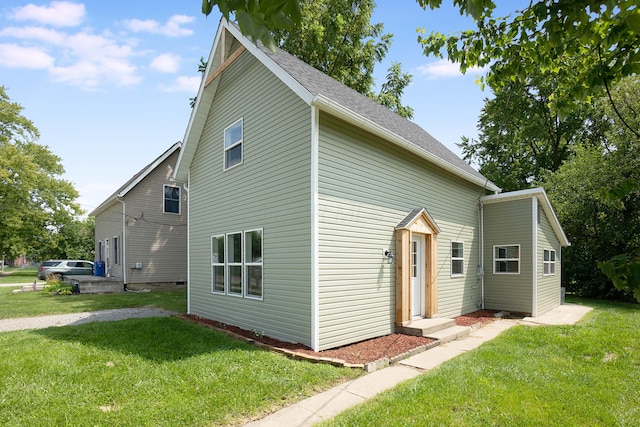 view of side of home featuring a lawn