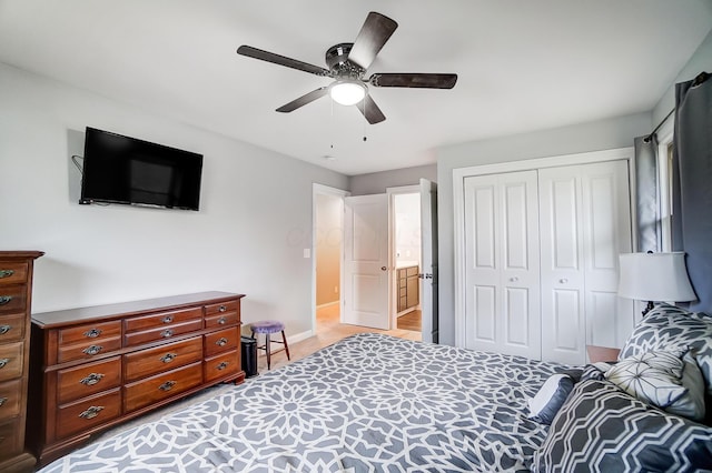 bedroom featuring ceiling fan and a closet