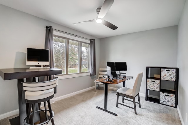 home office featuring ceiling fan and light colored carpet