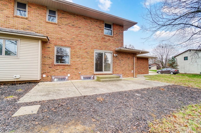 rear view of property featuring a patio