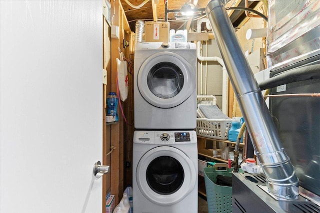 laundry room featuring laundry area and stacked washer and clothes dryer