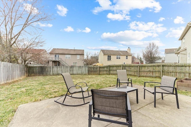 view of patio featuring a residential view and a fenced backyard