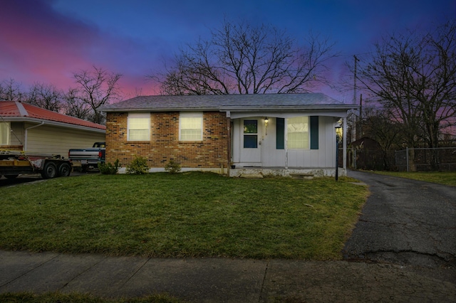 view of front of house with a yard