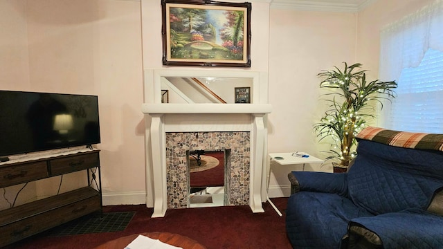 living area with crown molding