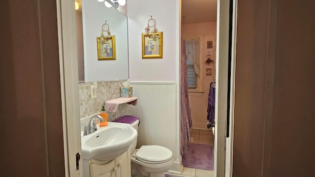 bathroom with vanity, tile patterned floors, and toilet