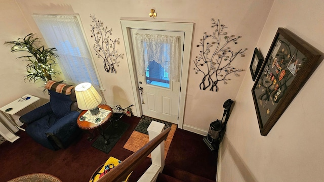 entryway featuring parquet flooring