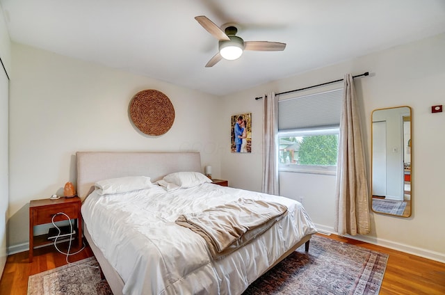 bedroom featuring dark wood-type flooring and ceiling fan