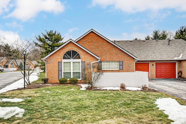 view of front of property with a garage and a front yard