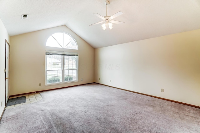 unfurnished room featuring high vaulted ceiling, carpet flooring, and ceiling fan