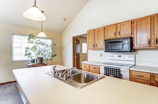 kitchen with white electric range, sink, decorative light fixtures, vaulted ceiling, and plenty of natural light