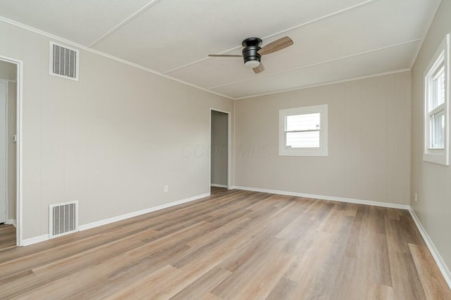 unfurnished room with ceiling fan, crown molding, light hardwood / wood-style floors, and a healthy amount of sunlight