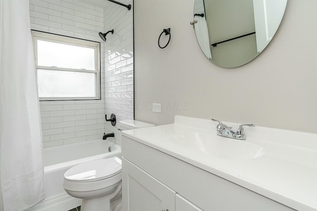 full bathroom with shower / tub combo with curtain, vanity, and toilet