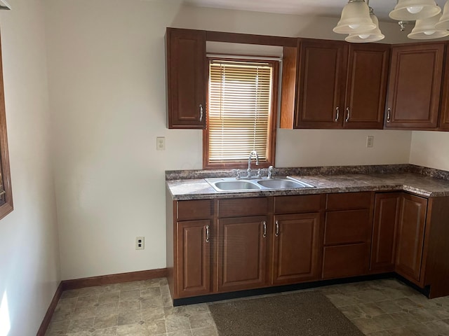 kitchen featuring decorative light fixtures and sink