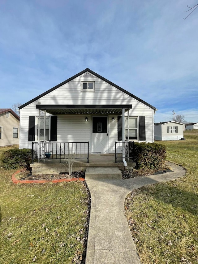 view of front of property with a front lawn and a porch