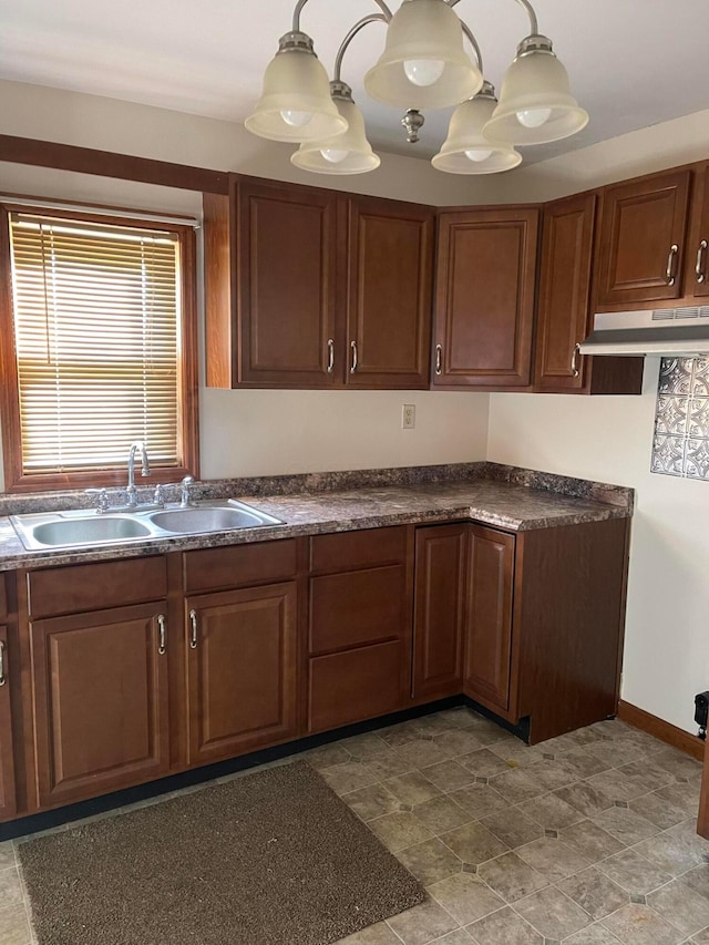 kitchen with sink and hanging light fixtures