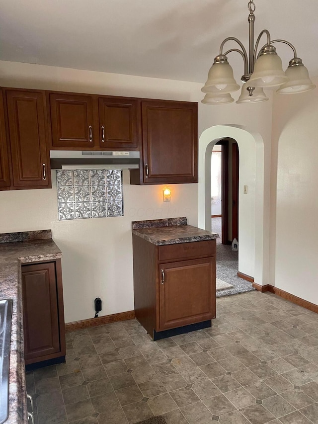 kitchen with pendant lighting and an inviting chandelier