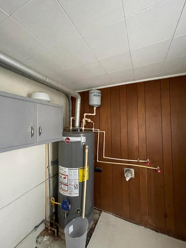 utility room featuring gas water heater