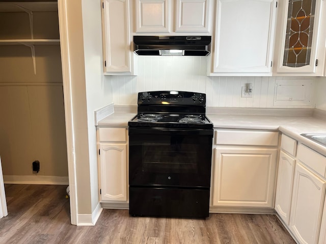 kitchen with white cabinetry, black range with electric cooktop, and light hardwood / wood-style floors