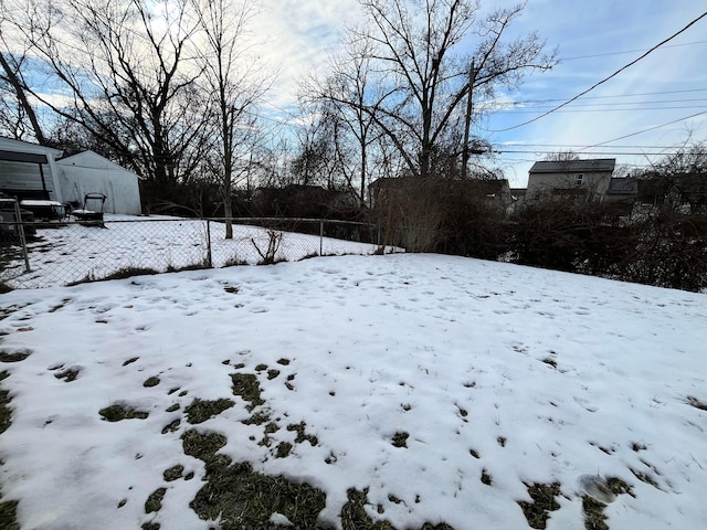 view of yard layered in snow