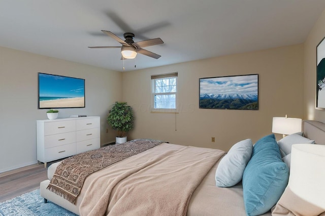 bedroom featuring ceiling fan and light hardwood / wood-style flooring