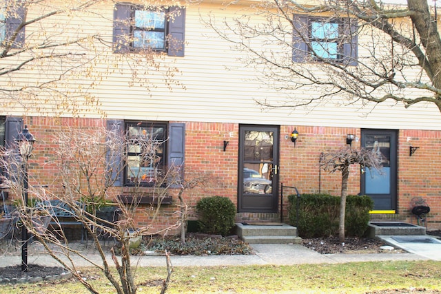 view of front of home with brick siding