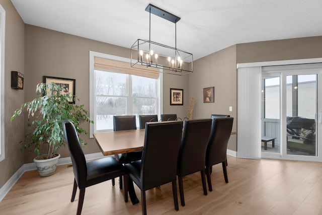 dining room featuring plenty of natural light and light hardwood / wood-style floors