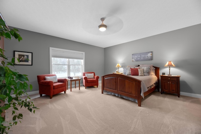 bedroom featuring ceiling fan and light colored carpet