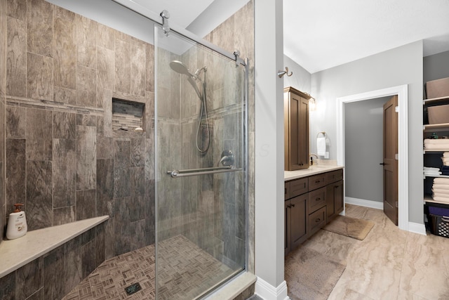 bathroom with vanity and walk in shower