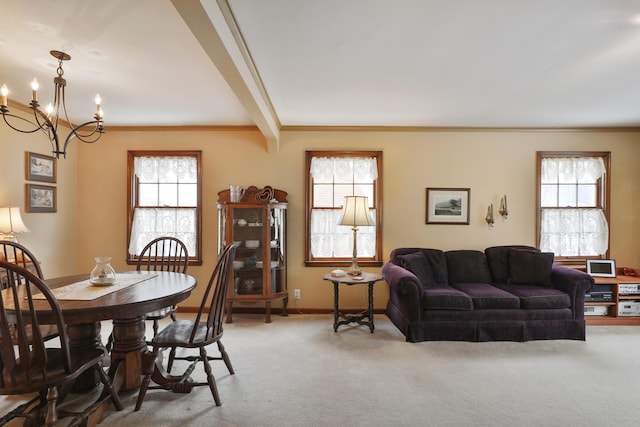 carpeted dining area featuring a wealth of natural light, a notable chandelier, and beam ceiling