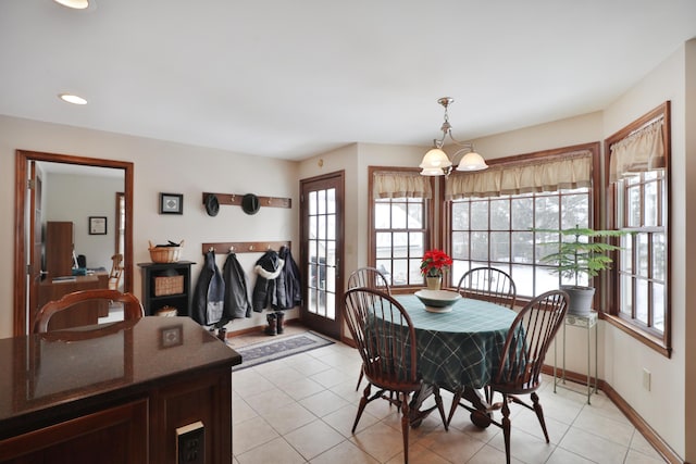 dining area featuring light tile patterned floors