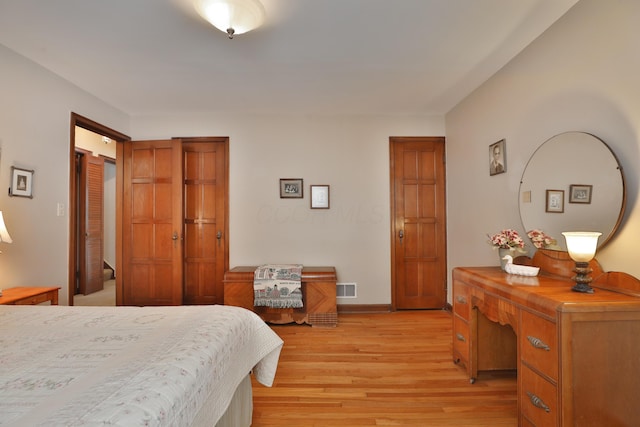 bedroom with light hardwood / wood-style floors