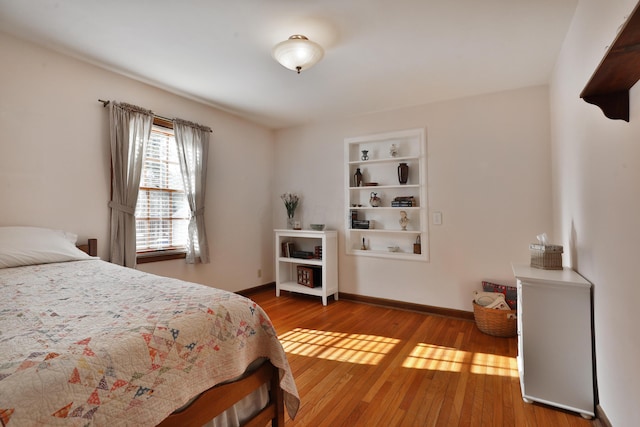 bedroom with hardwood / wood-style flooring