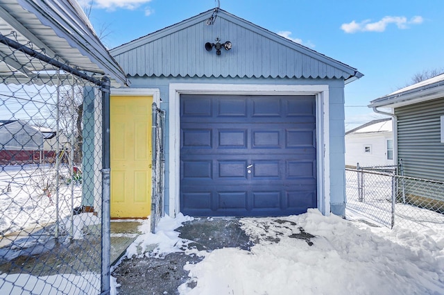 view of snow covered garage