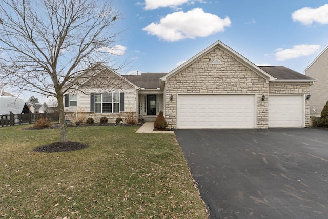 ranch-style home featuring a front lawn, driveway, an attached garage, and fence