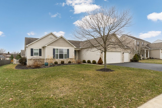 view of front of home with a front yard, fence, a garage, stone siding, and driveway