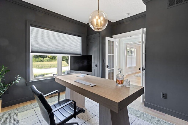 office area with ornamental molding, a chandelier, and light hardwood / wood-style floors