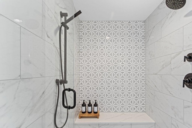 bathroom with tiled shower