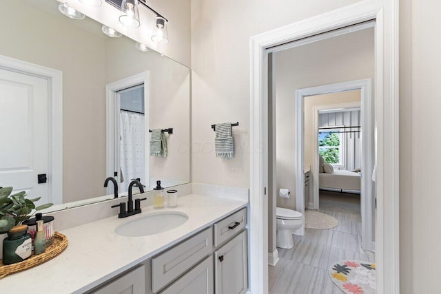 bathroom with vanity and toilet