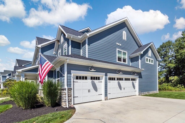 view of side of home with a garage