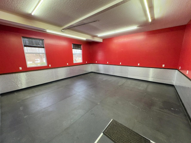 spare room featuring a textured ceiling