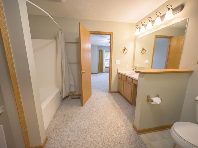 full bathroom with vanity, shower / tub combo, toilet, and a textured ceiling