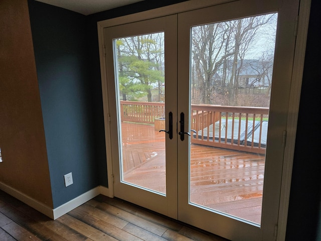 doorway with hardwood / wood-style floors and french doors