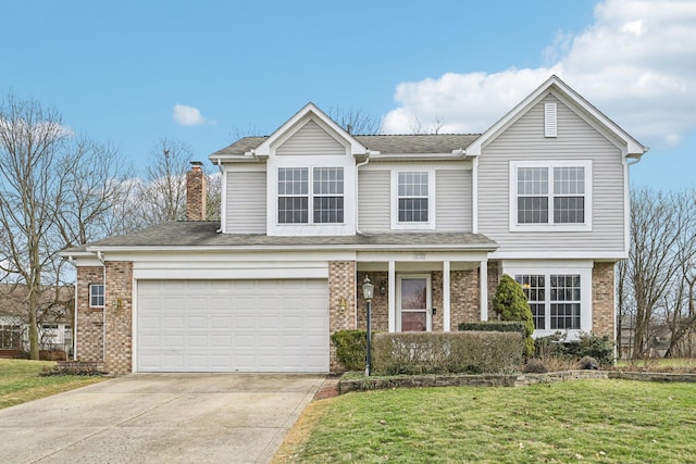 view of front property featuring a garage and a front lawn