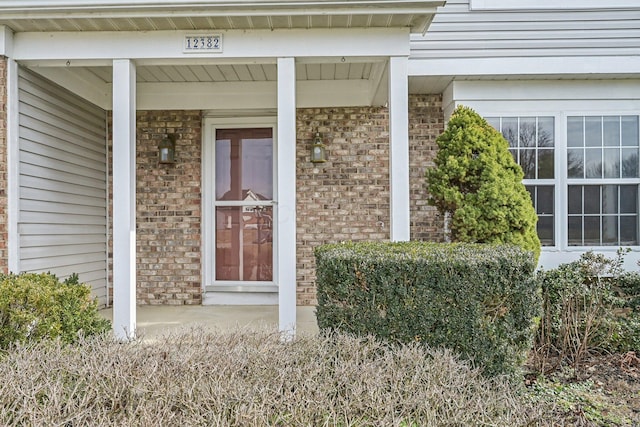 doorway to property with covered porch