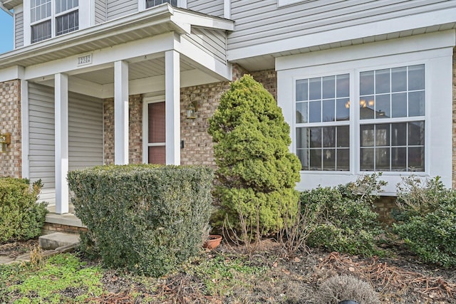 doorway to property featuring covered porch