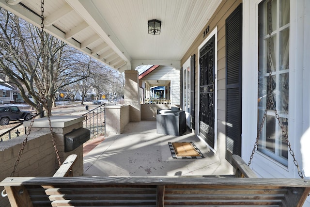 view of patio featuring a porch