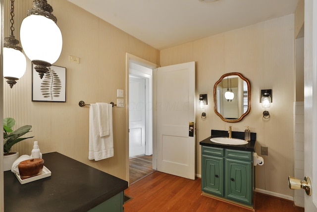 bathroom with vanity and hardwood / wood-style floors