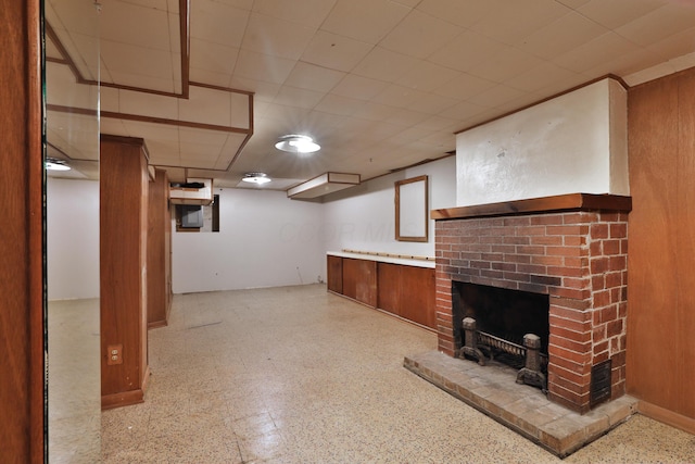 basement with a brick fireplace